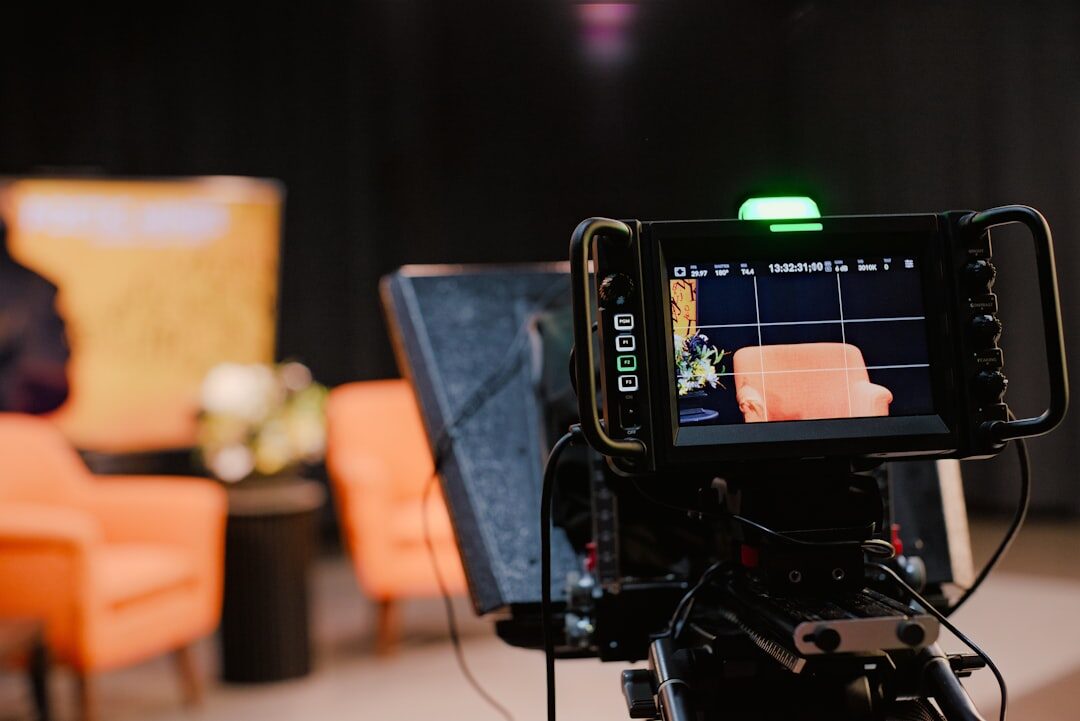 Professional broadcast video camera on tripod in a studio