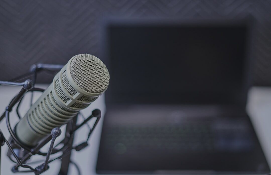 Modern podcast recording setup with large condenser microphone